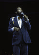 Marvin Gaye performing on stage in a blue suit photo print