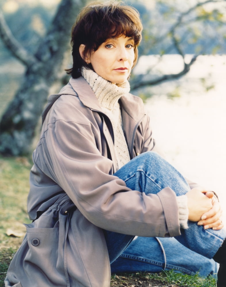 Portrait photo print of Kathleen Quinlan in a gray leather jacket.