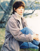 Portrait photo print of Kathleen Quinlan in a gray leather jacket.