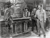 Rio Bravo cowboy photo print featuring a man pointing a gun in classic outfit.