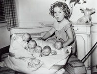 Shirley Temple playing with baby dolls photo print.
