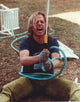 David Spade holding a water hose photo print