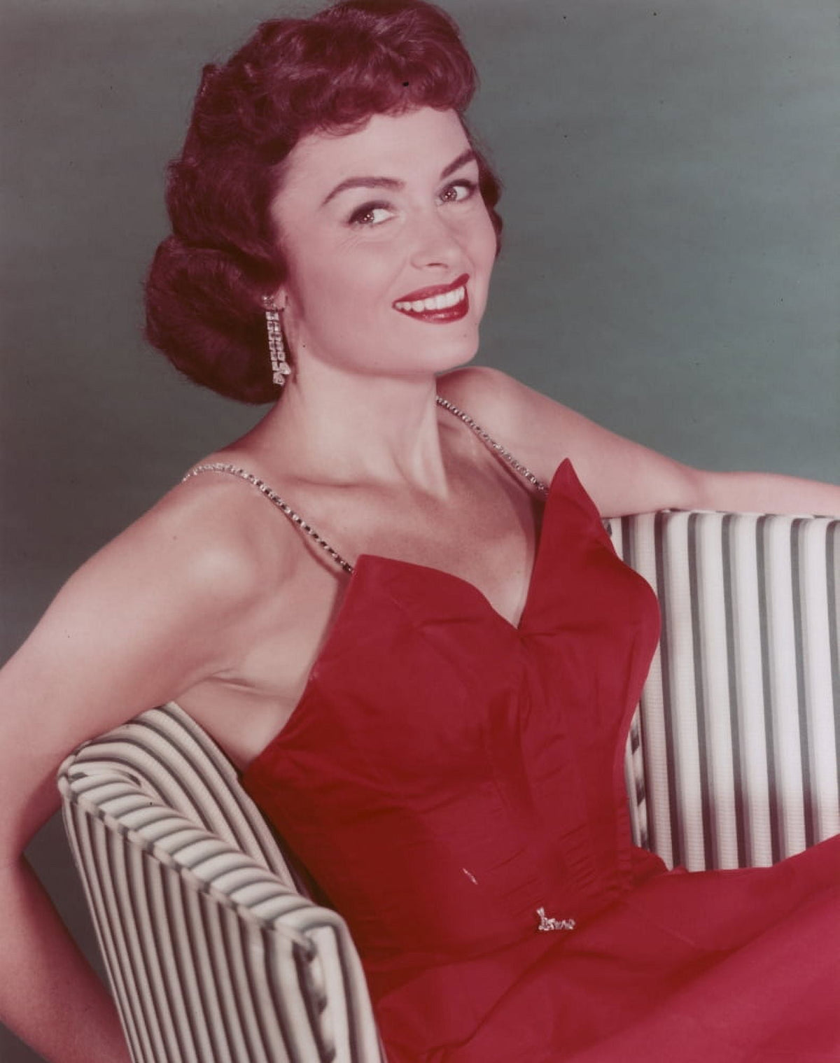 Donna Reed posing in a red gown photo print.