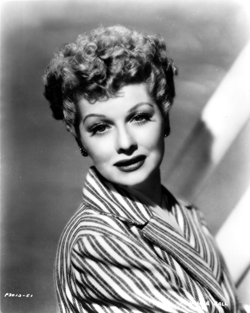 Lucille Ball smiling in a striped suit photo print