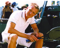 Photo print of Paul Bettany seated in a white polo shirt