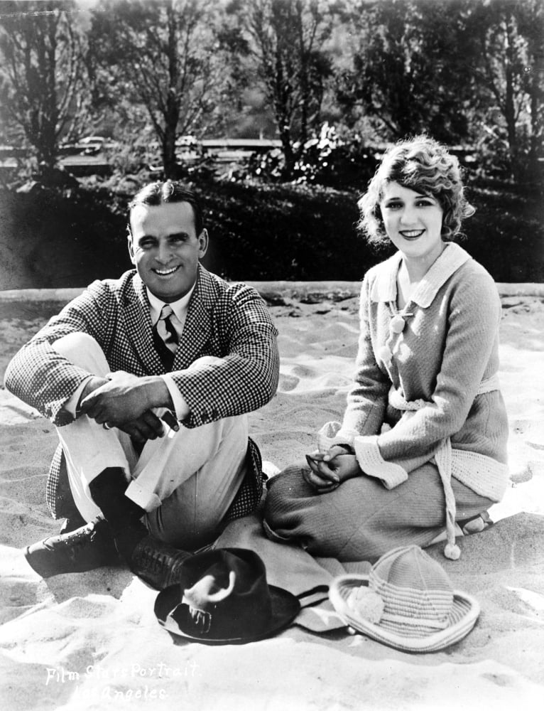 Candid photo print of Douglas Fairbanks Sr. and Mary Pickford.