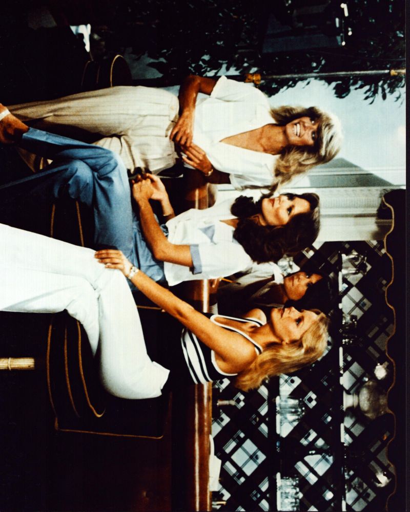 Charlie's Angels cast photo print featuring Farrah Fawcett, Jaclyn Smith, Kate Jackson, and Cheryl Ladd at a bar.