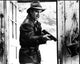Kevin Costner yelling holding gun in The Untouchables black and white photo print