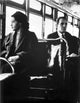 Rosa Parks seated on a public vehicle, iconic civil rights moment photo print.