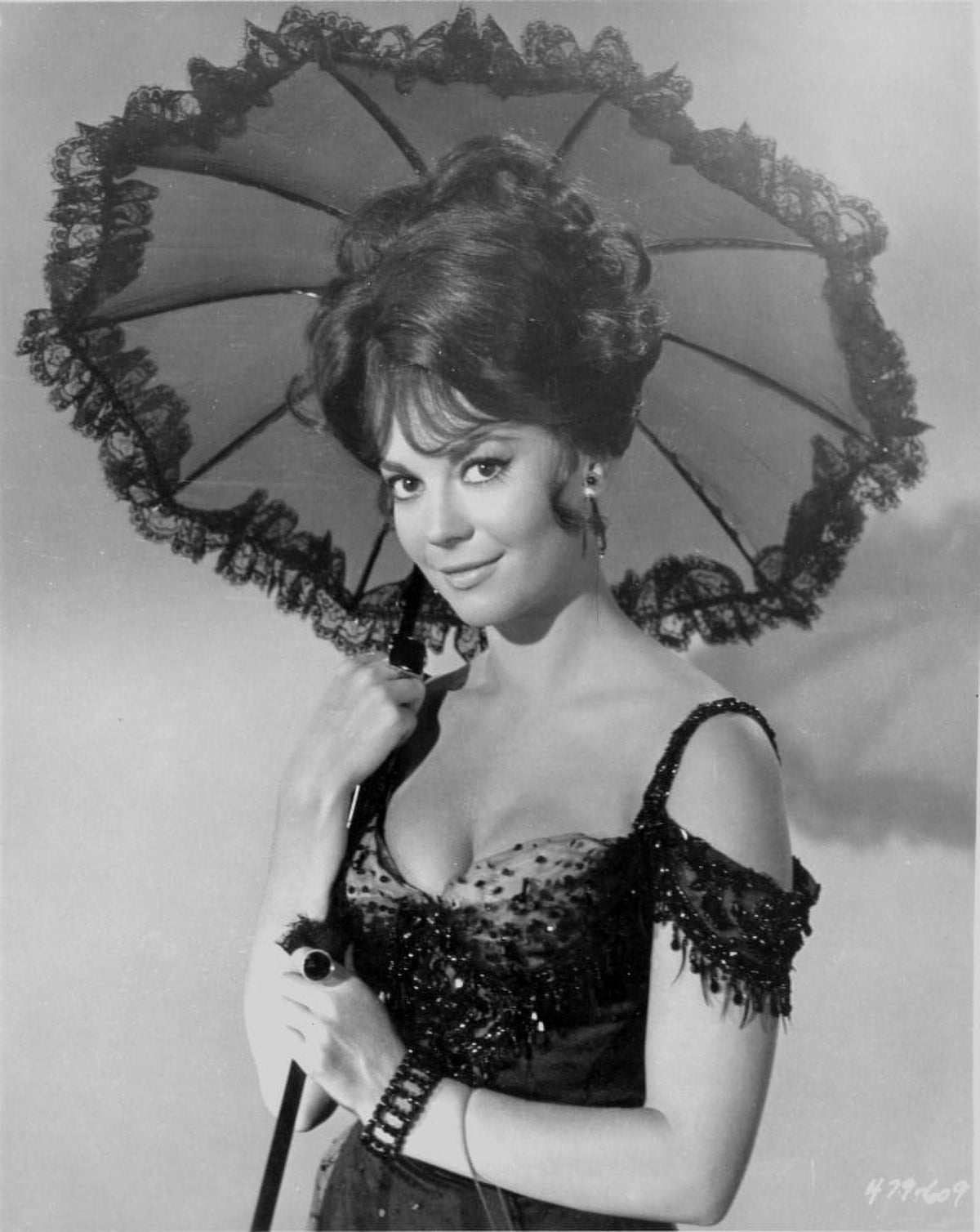 Natalie Wood holding an umbrella photo print in vintage style.