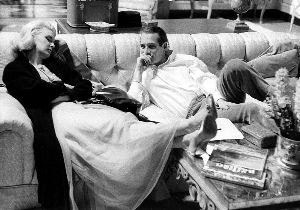Paul Newman and Joanne Woodward photo print on a sofa.