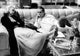 Paul Newman and Joanne Woodward photo print on a sofa.
