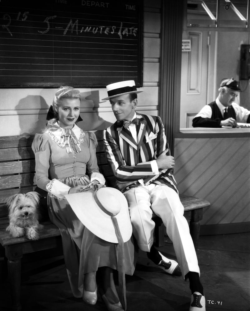 Fred Astaire and Ginger Rogers seated on a bench with a dog photo print.