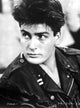 Charlie Sheen wearing a leather jacket photo print.
