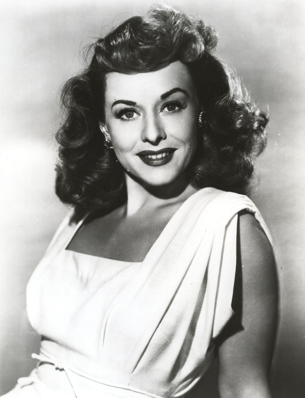 Paulette Goddard smiling portrait photo print in white dress.