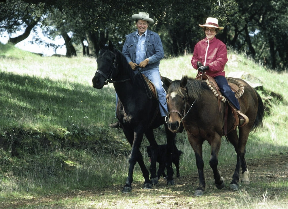 Ronald and Nancy Reagan riding horses on ranch in Santa Barbara, California photo print.