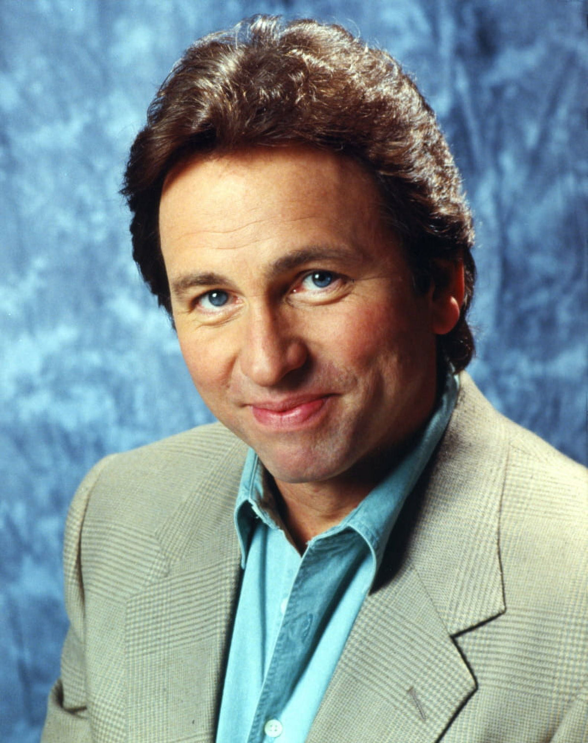 Close-up portrait photo print of John Ritter wearing a suit with light blue undershirt.