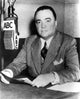 Edgar J Hoover talking on the radio photo print, available in multiple sizes.