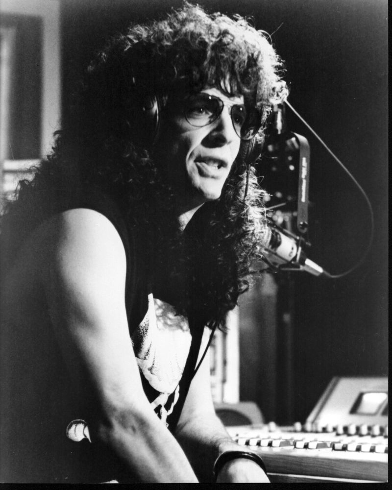 Howard Stern black and white photo print at radio desk.