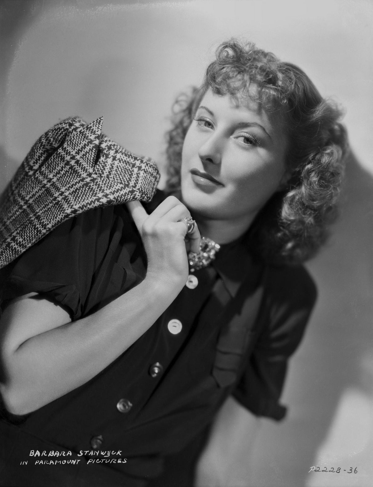 Portrait of Barbara Stanwyck wearing a black dress photo print