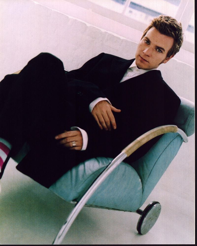 Ewan McGregor sitting in a suit photo print, available in multiple sizes.