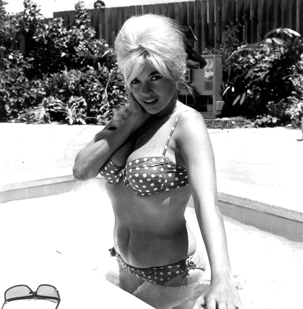 Jayne Mansfield wearing a polka dot bikini in a swimming pool photo print