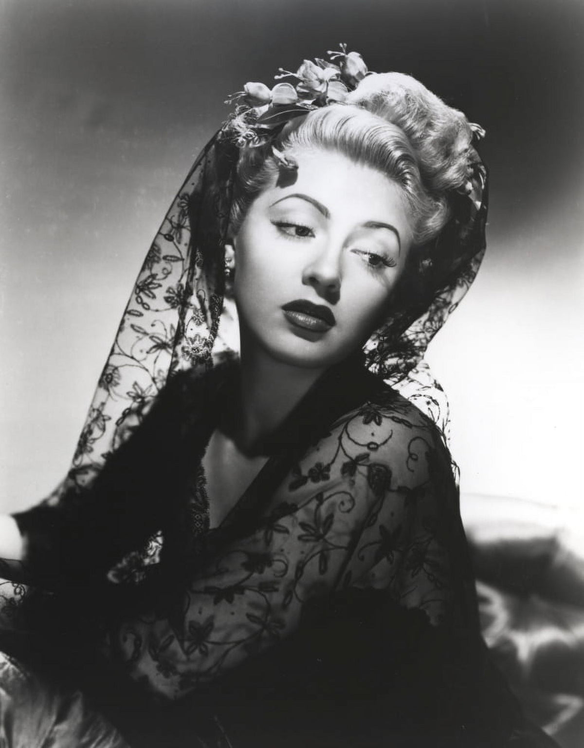 Lana Turner posed in an elegant black dress photo print