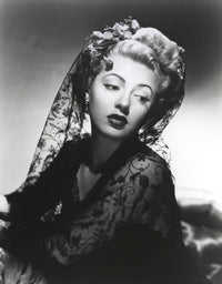 Lana Turner posed in an elegant black dress photo print
