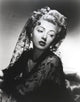 Lana Turner posed in an elegant black dress photo print