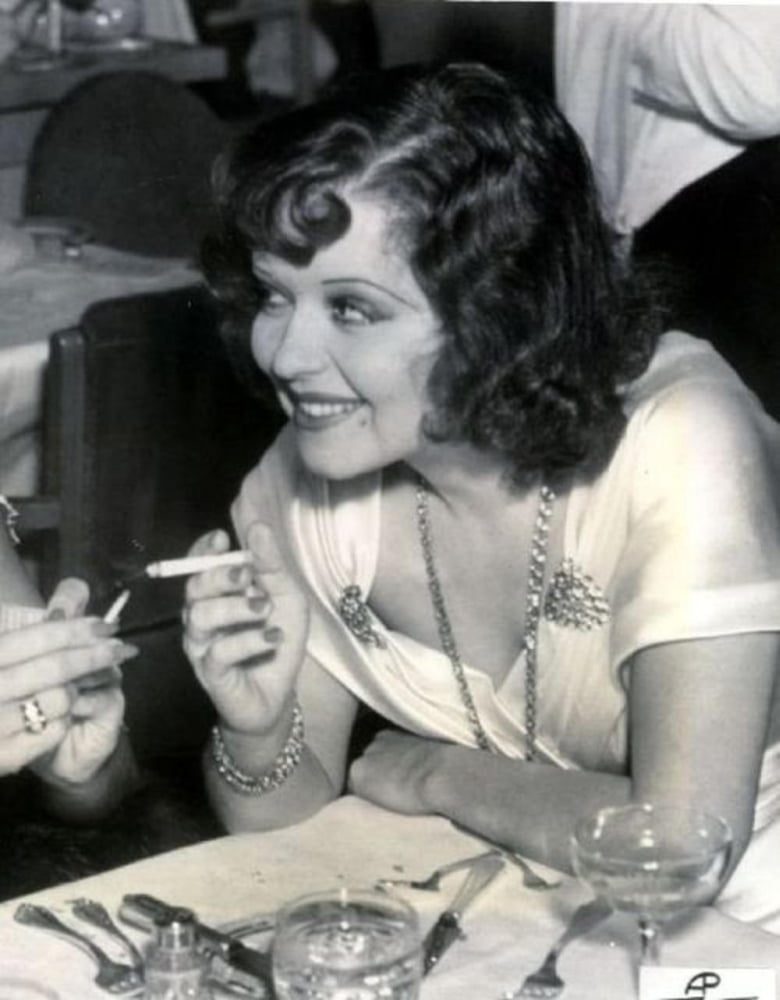 Clara Bow Smoking Photo Print showcasing classic Hollywood glamour in multiple sizes.