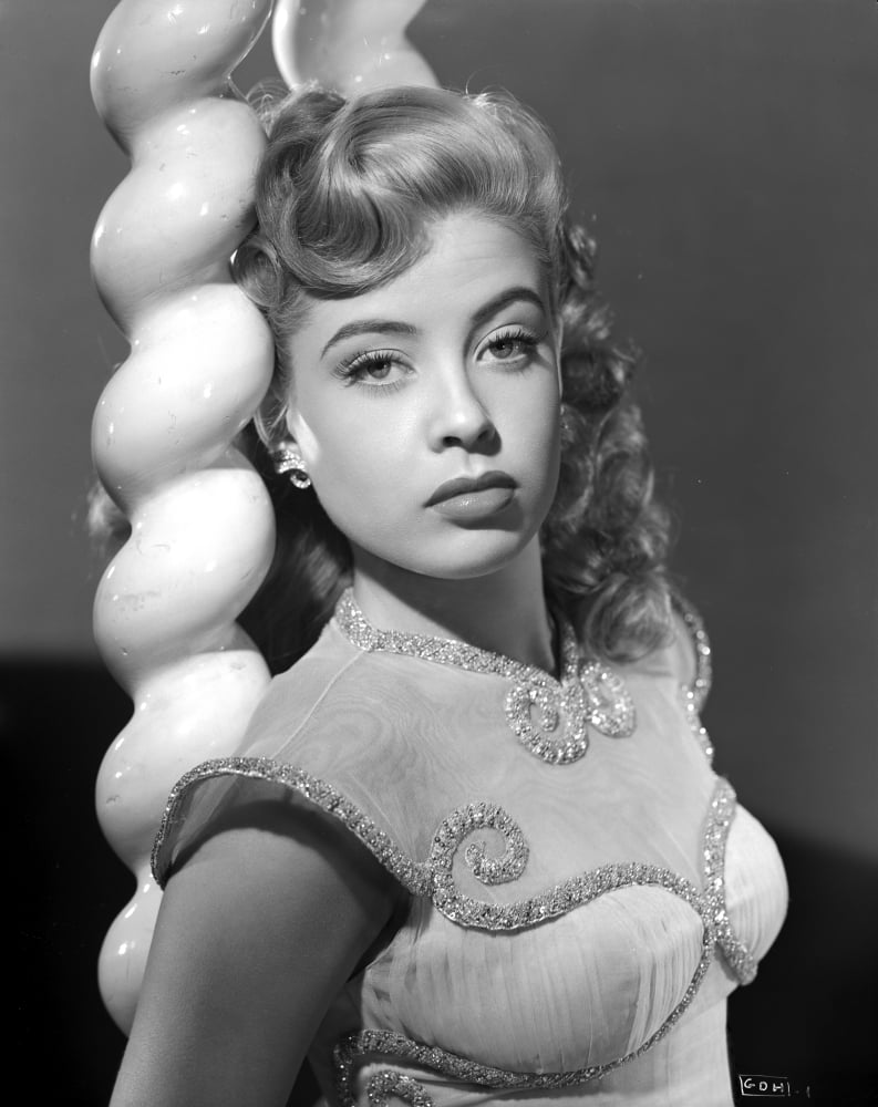 Gloria DeHaven black and white photo print leaning on a pole