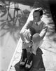 Fred Astaire seated in a sweater photo print, classic Hollywood decor.