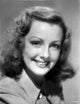 Virginia Grey smiling portrait photo print on premium heavy stock paper.