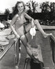 Janet Leigh vintage photo print in grey swimsuit posing by the pool.