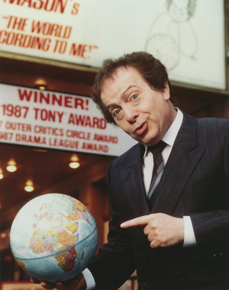 Jackie Mason photo print in suit and tie pointing at a globe.