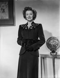 Myrna Loy posed elegantly in a classic black dress photo print.