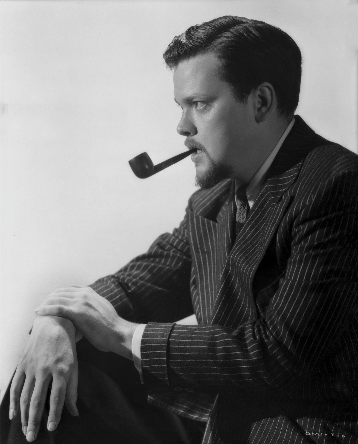 Orson Welles classic photo print featuring a pipe in his mouth.