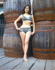 Linda Harrison leaning on barrels photo print