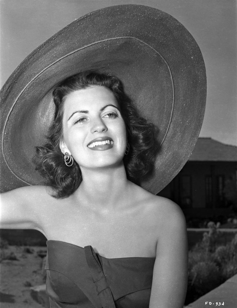 Faith Domergue wearing a floppy beach hat photo print.