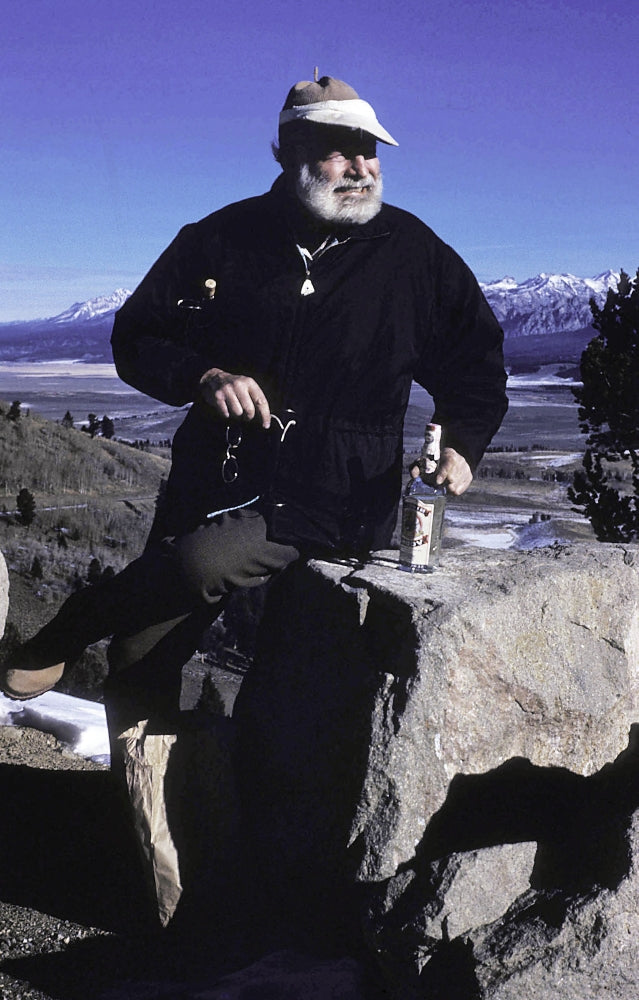 Ernest Hemingway photo print on a mountainside, available in multiple sizes.