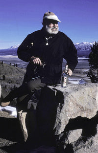 Ernest Hemingway photo print on a mountainside, available in multiple sizes.