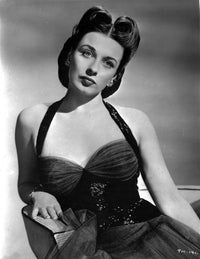 Patricia Morrison seated in halter dress photo print