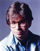 Rick Moranis smiling in a blue shirt photo print