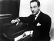 Victor Borge playing piano photo print in a classic style.