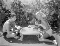 Douglas Fairbanks Jr. and Joan Crawford playing backgammon photo print