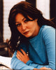 Shannen Doherty leaning forward in blue top photo print.