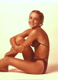 Dana Plato sitting in a bikini photo print, nostalgic pop culture art.