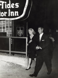 Marilyn Monroe and Joe DiMaggio photo print featuring classic Hollywood charm.