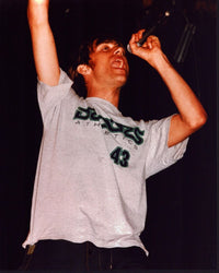 Damon Albarn singing with arm raised photo print