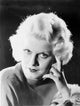 Jean Harlow portrait photo print in round neck pleated dress.